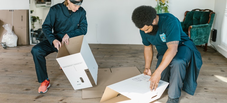 Movers handling customer's belongings