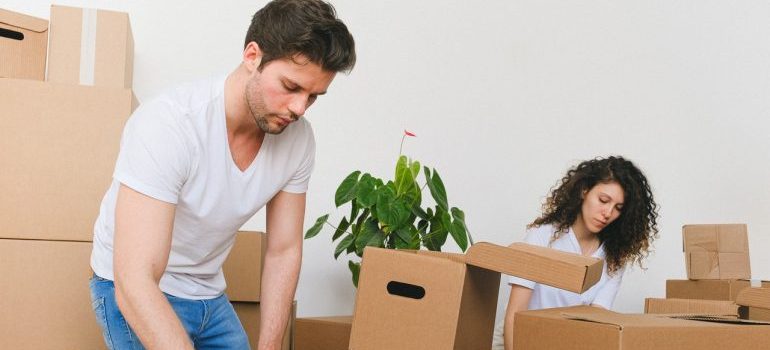 Couple packing for the move.