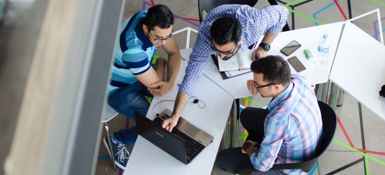 three people in an office