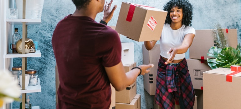 a couple having fun during the move