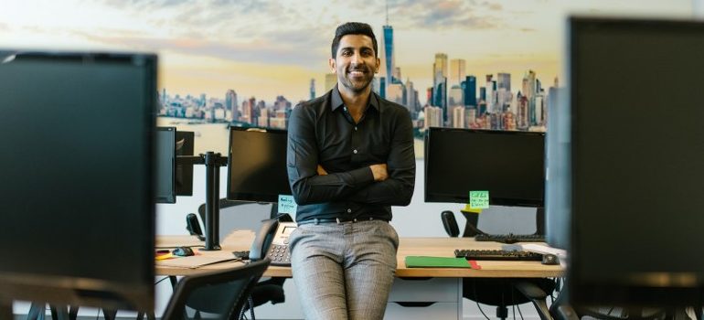 a person in an office, smiling