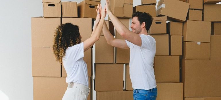 Two people happy to find the perfect moving company