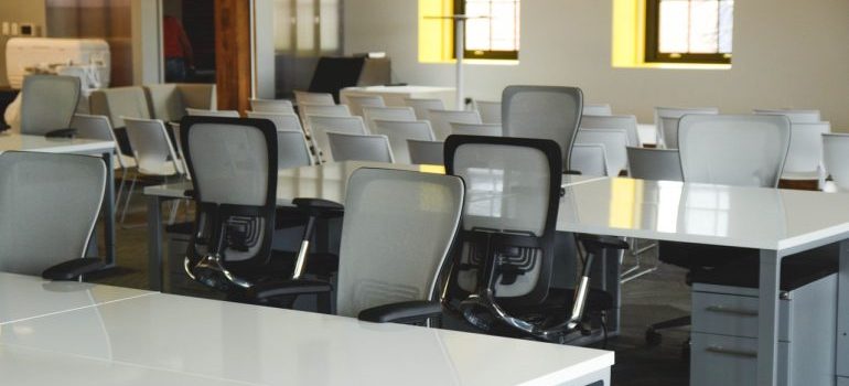 An office white white desks and chairs