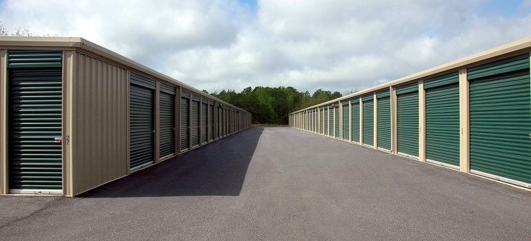 Storage units with green doors.