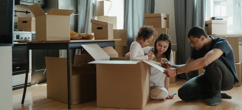 Family packing things for a move.