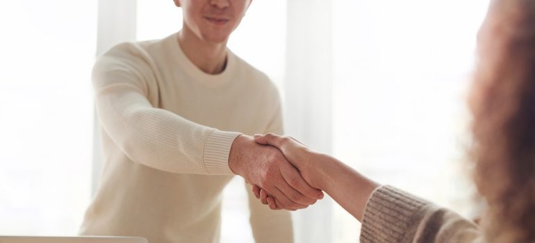 A man and a woman shaking hands