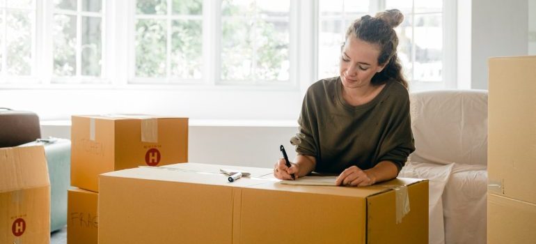 Woman packing a  moving box