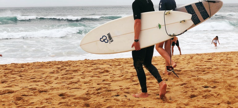 two guys going surfing