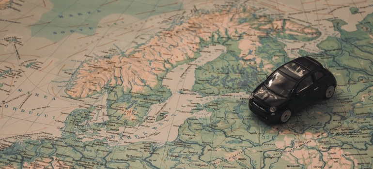 World map and toy car