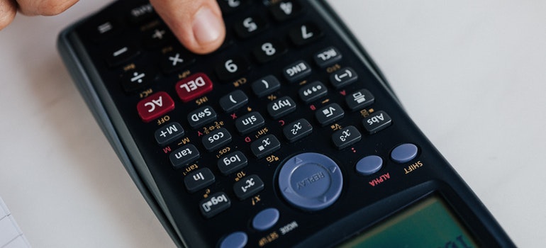A person using a calculator