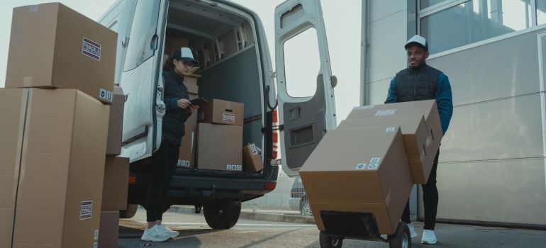 Movers packing moving boxes