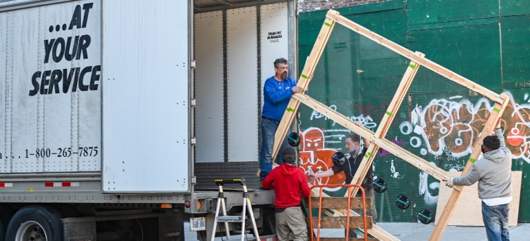 Trusted movers loading items onto a moving truck