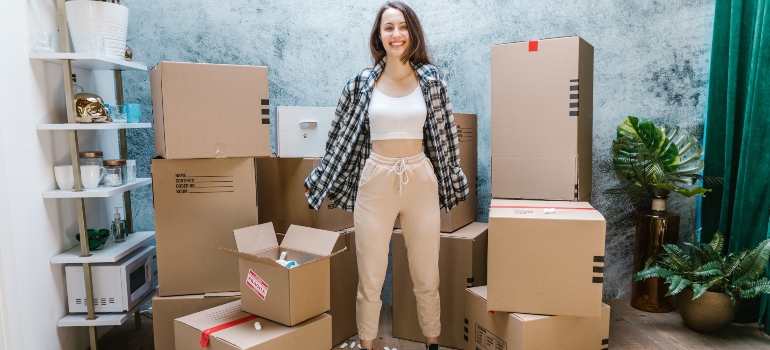 a woman surrounded with boxes 