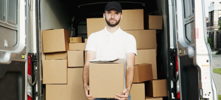 a man holding the box