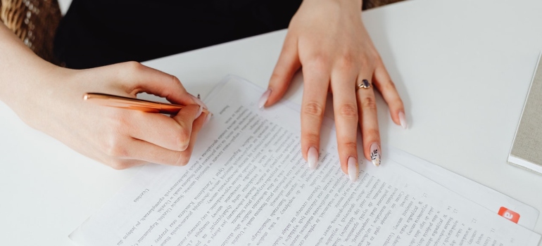 Woman signing a document