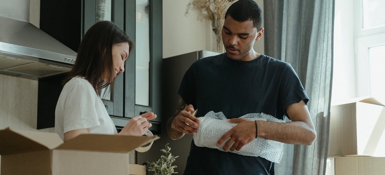 a couple packing their stuff