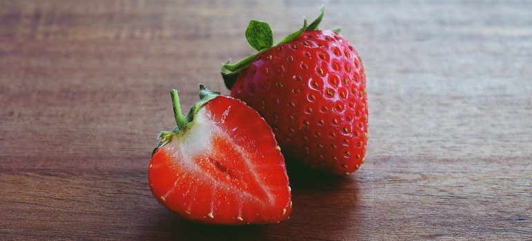 Strawberries on a brown surface 