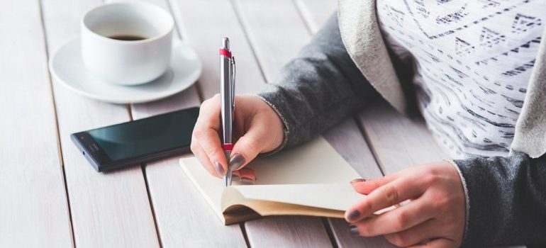 woman writing in a notebook