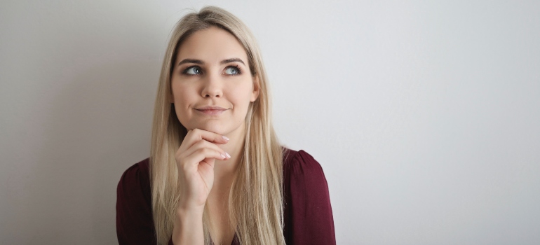 blonde woman thinking about something