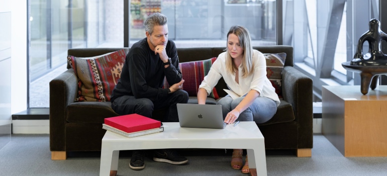 man and woman learning about Cost-Saving Strategies for Selling Your Home