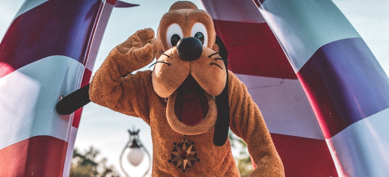 A man in a pluto costume 