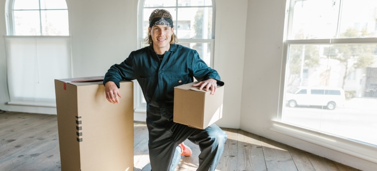 A mover holding a box 