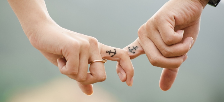 couple holding for fingers