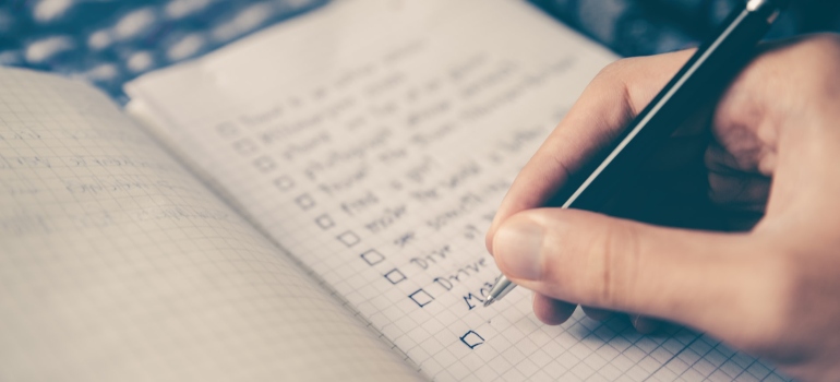 A woman writing a list