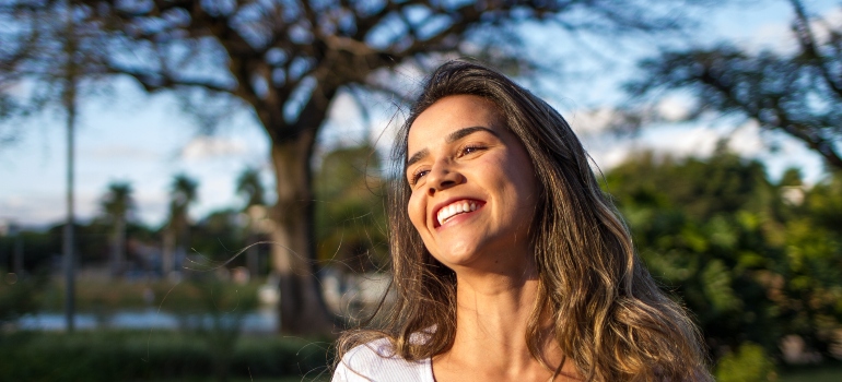 woman smiling after she has hired long distance movers Palm Harbor FL