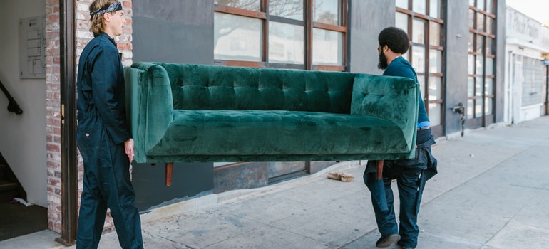 Pinellas Park movers carrying a couch