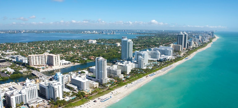 Aerial View of City Buildings Near Body of Water - one of the famous beaches in Miami.