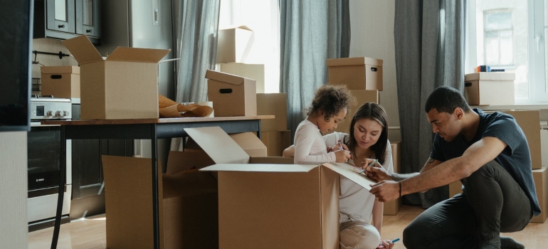 A family packing for their Long-distance movers South Miami to take them to their new home