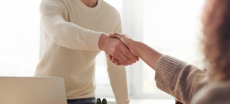 A handshake between a man and a woman