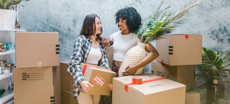 two women happy for finding residential movers Palm City FL has