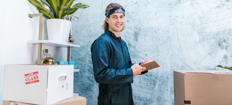 A smiling man making an inventory