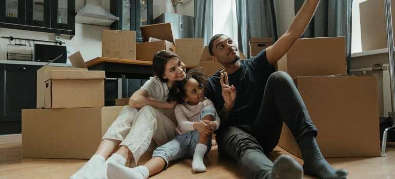 a happy family having fun after the move