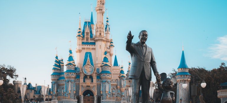 People Walking Around Disney Castle.