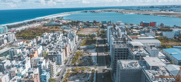 Moving to Pembroke Pines - Modern building facades near endless sea under the sky.