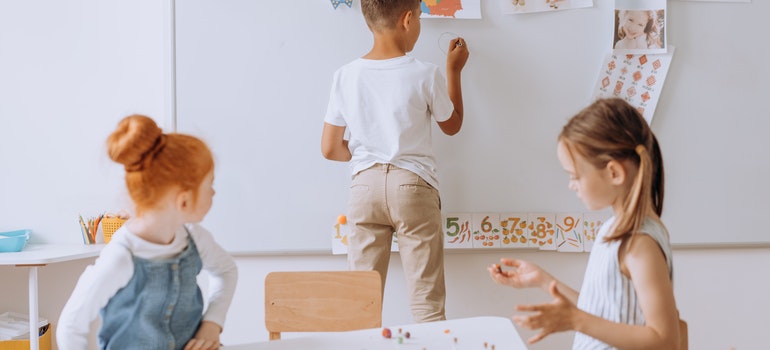 Three kids in a classroom