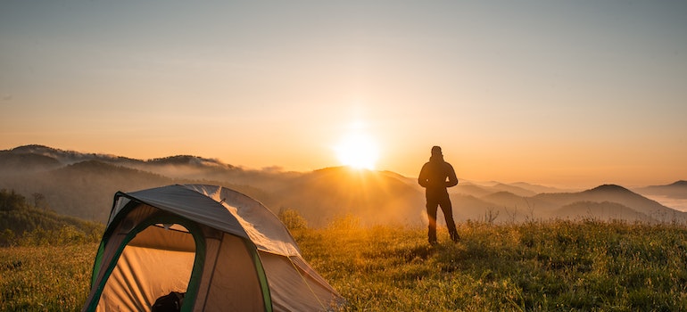 A person in front of a tent