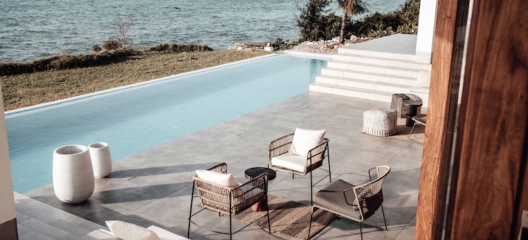 Patio of a House with a Swimming Pool on Seashore. 