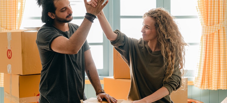 A couple giving a high five to each other