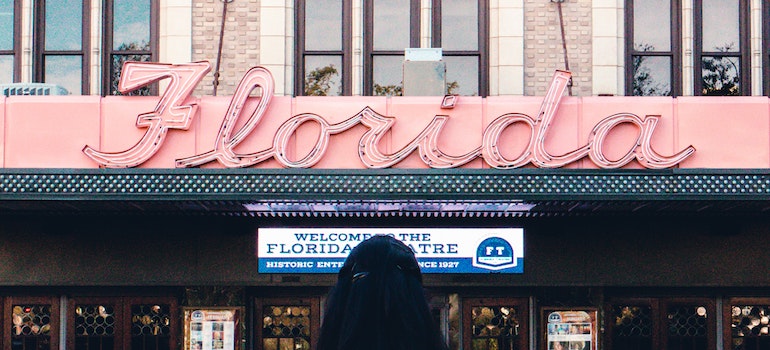 A girl in front of Florida sign