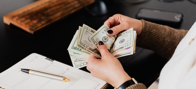 A person Counting Cash Money.