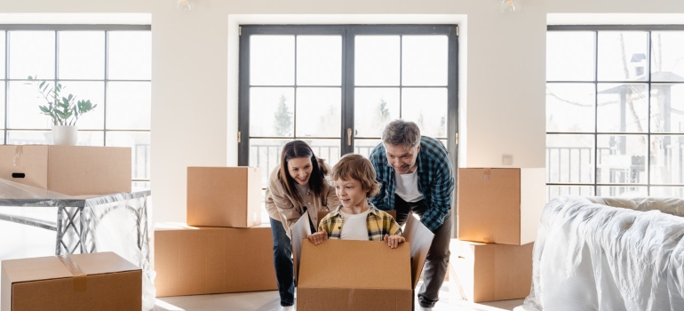 Happy family moving with long distance movers Lutz FL has to offer