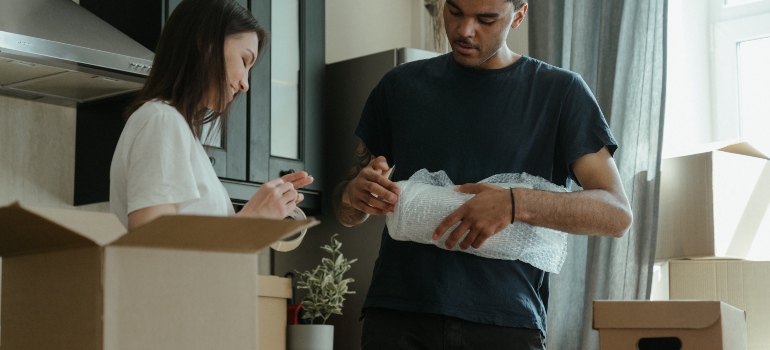 Woman and man packing stuff