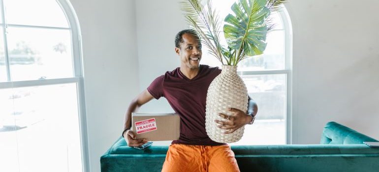 man smiling because he found the best long-distance movers Silver Lake FL