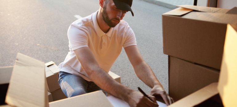 a man checking if all boxes are accounted for