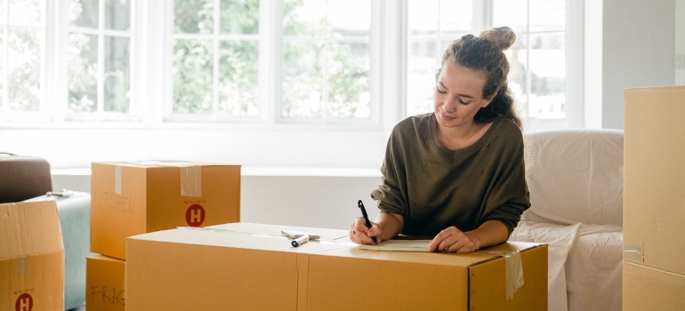 a woman packing up 