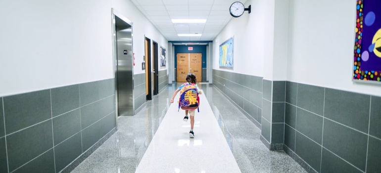 A kid running in the school hall. Moving to Orlando with kids will not be a problem, there are many schools there.